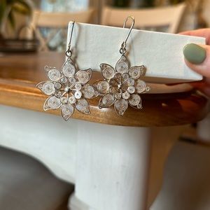 Coiled silver medallion earrings from Ecuador.